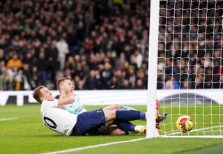 Harry Kane slides home Tottenham's third goal