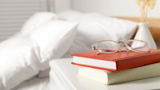 Books and glasses on nightstand