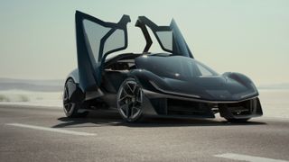 A black Lotus Theory 1 concept car with gull-wing doors up.