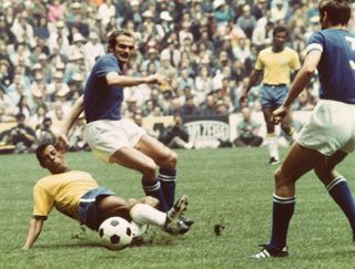 Brazil's Carlos Alberto tackles Italy's Sandro Mazzola during the 1970 World Cup final in Mexico.