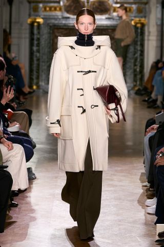 The model is wearing a duffle coat.