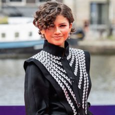 Zendaya attended the Amsterdam premiere of 'Spider-Man: Brand New Day' in a Louis Vuitton tailcoat and a strawberry red skirt