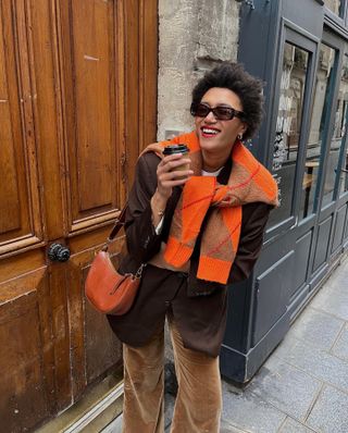 Lena Farl wearing autumn outfit and bright red lipstick