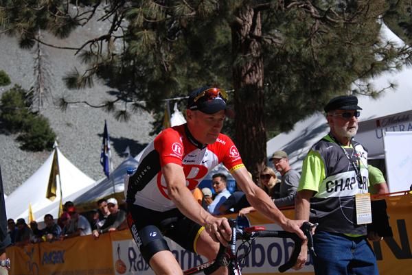 Chris Horner is escorted to doping control after the Tour of California Mt. Baldy stage.
