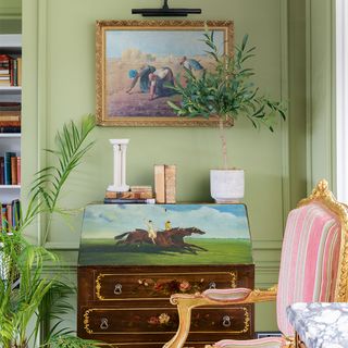 green living room with antique bureau