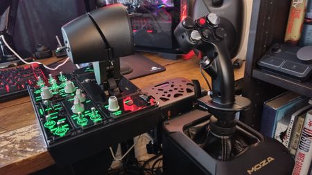 A Moza AB9 FFB Base, MH16 Flightstick, and MTP Throttle attached to a desk