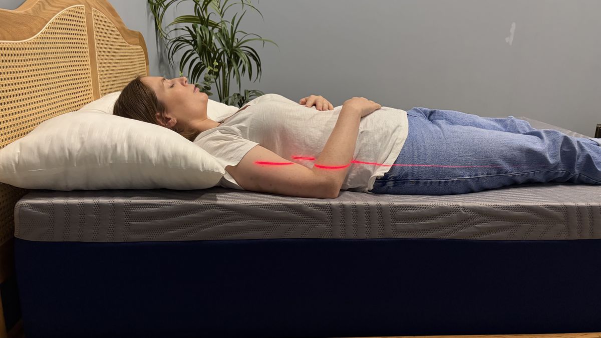 A mattress tester back sleeping on the SweetNight CoolNest Mattress.