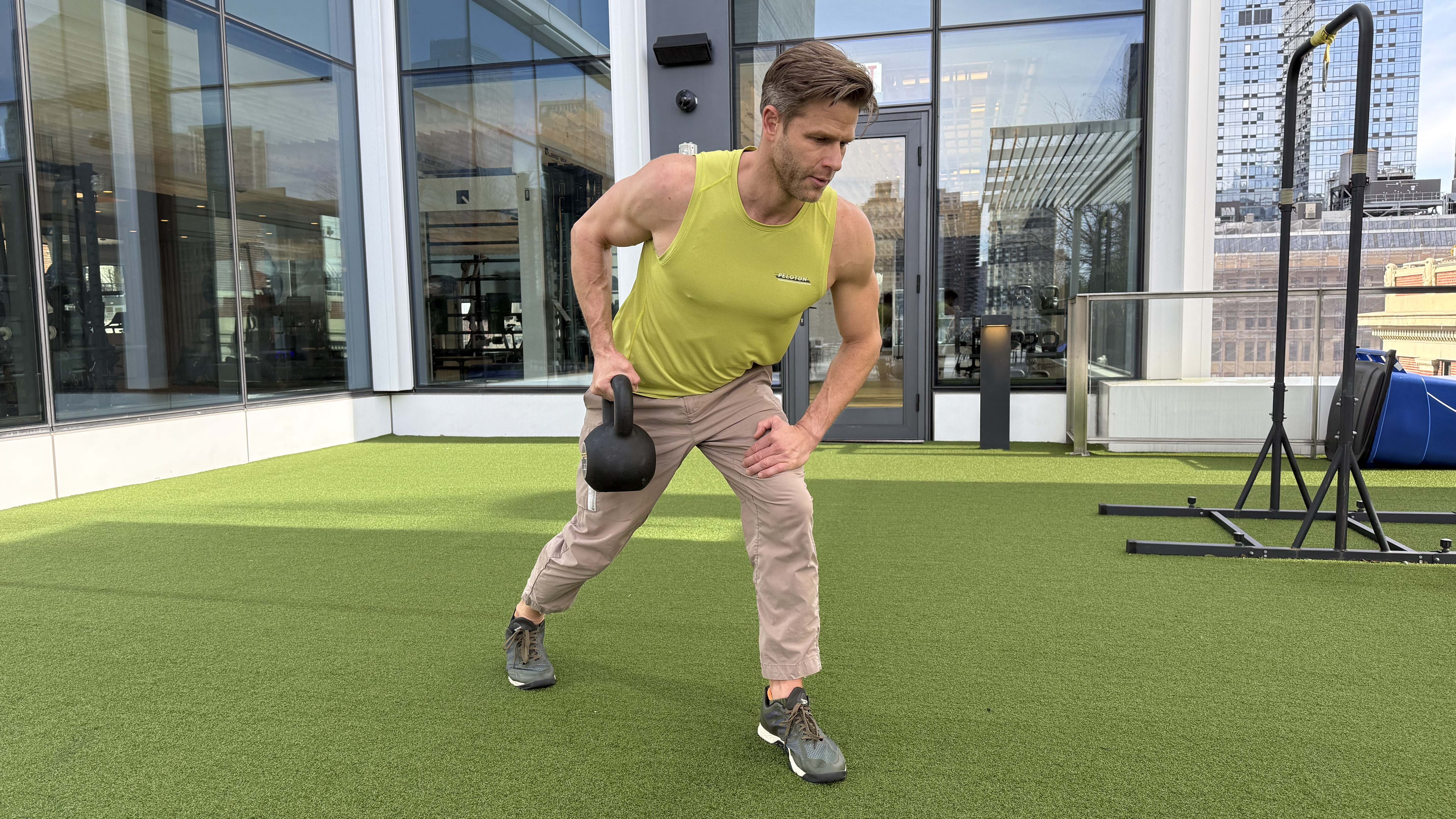 a photo of Peloton trainer Andy Speer doing a kettlebell single-arm row