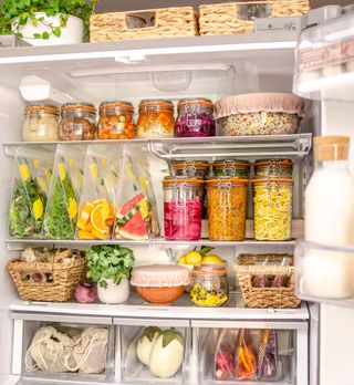 A colorful fridge with multiple food storage containers