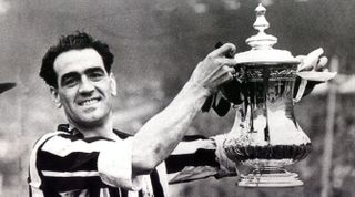 FA Cup Final 1952. Newcastle United vs Arsenal. 03/05/1952. Joe Harvey holding the FA Cup after Newcastle's victory over Arsenal. Skipper Joe Harvey shows off the trophy to the cameras after the final whistle. Little did he know that he’d be back again next year. (Photo by ncjMedia Ltd/NCJ Archive/Mirrorpix via Getty Images)