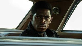 Damson Idris as Franklin in the backseat of a car in Snowfall season 6 episode 8