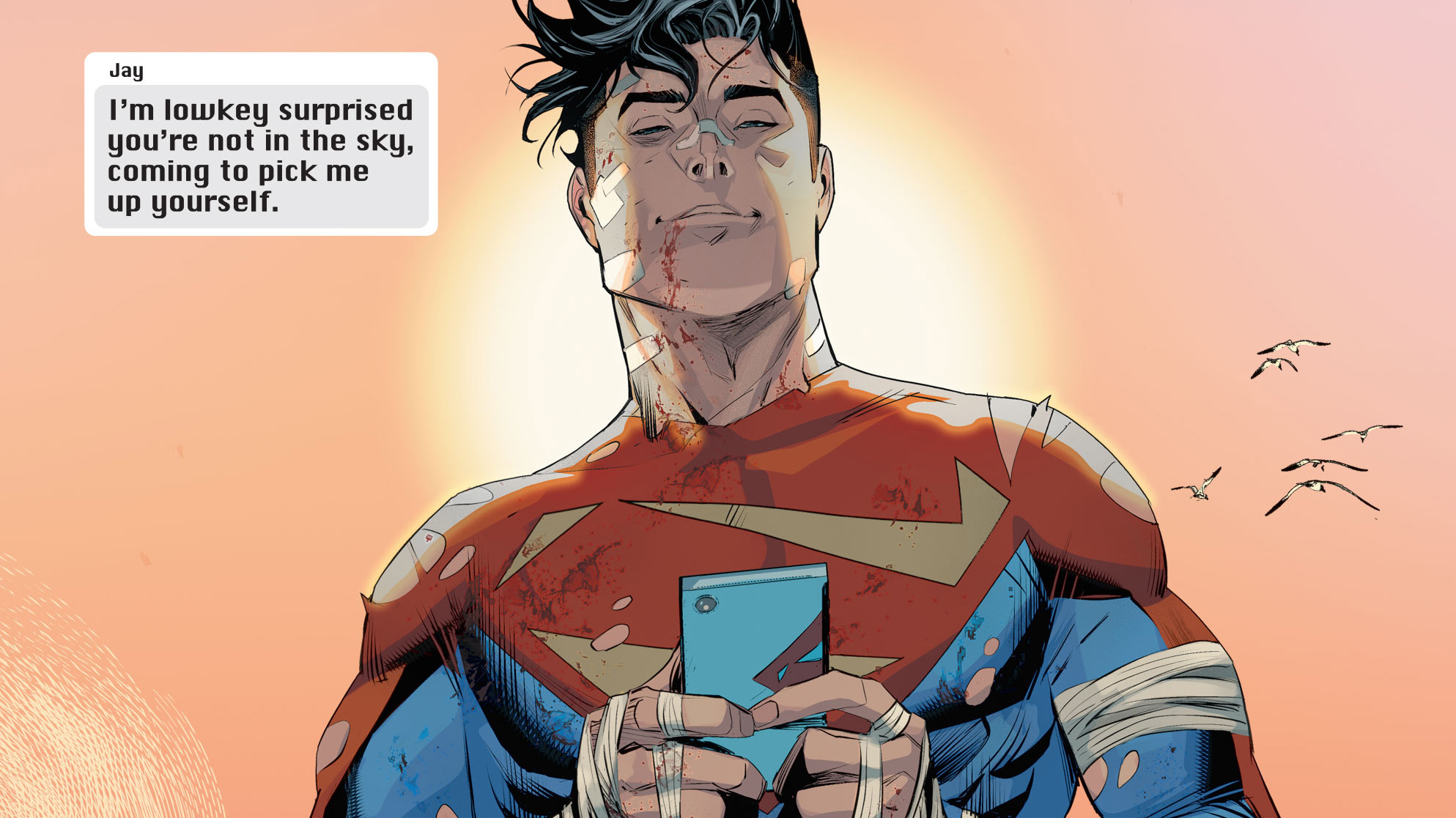 Jon Kent patrzy na swój telefon.