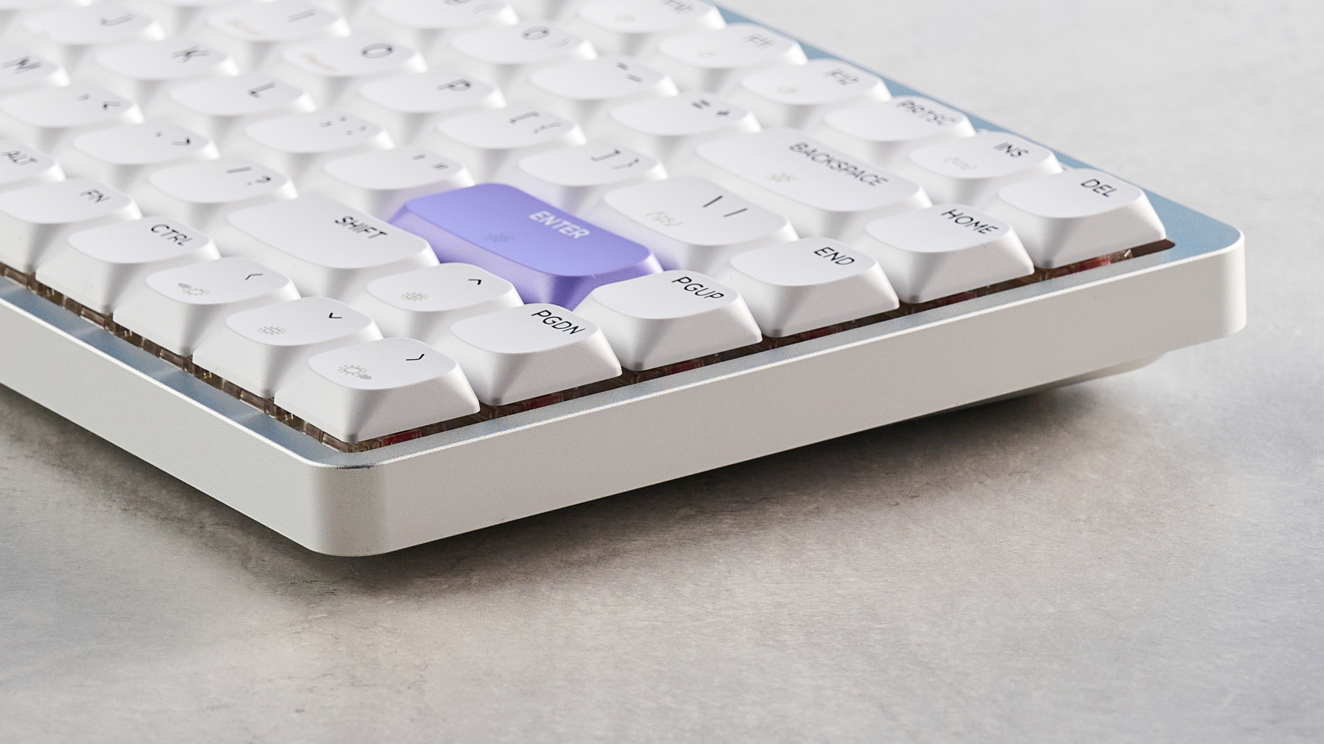 A white and purple Epomaker Luma84 low-profile mechanical keyboard