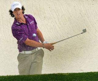 Rory McIlroy hits a bunker shot