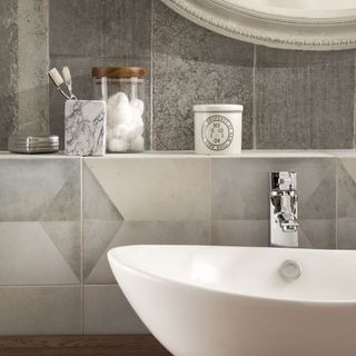 bathroom with wash basin and geomento tiles