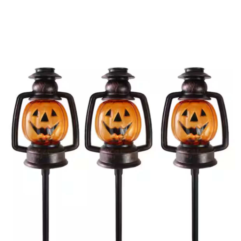 Three pumpkin pathway lights