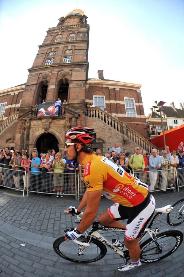 Fabian Cancellara in gold heads to the start.