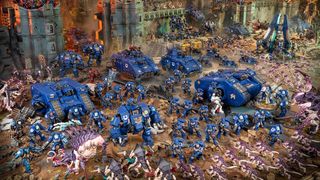 Ultramarines fighting Tyranids in a game of Warhammer 40K.