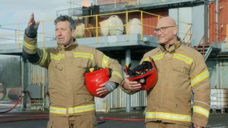 John Torode and Gregg Wallace dressed up in fire fighter outfits.