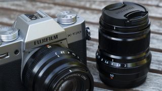 The Fujifilm X-T20 camera on a garden table
