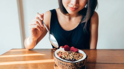 Woman eating healthy breakfast