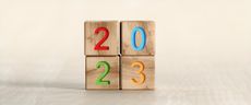 2023 text on wooden toy blocks stacked as a square