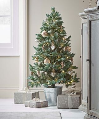 Christmas tree in a silver metal pot