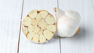 twp garlic bulbs, one sliced in half