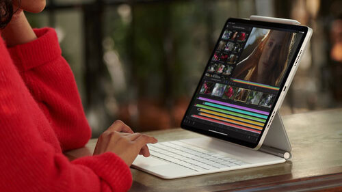 Woman using iPad Pro with stand