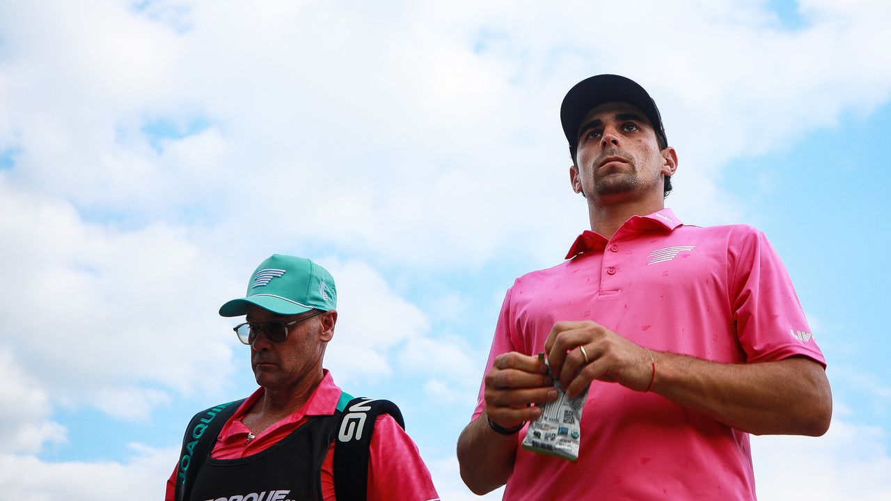 Joaquin Niemann and his caddie