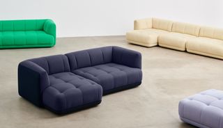 Shot in a studio space with concrete floor, the Quilton sofa is seen here in different configurations, in colours including cream, blue, grey and green
