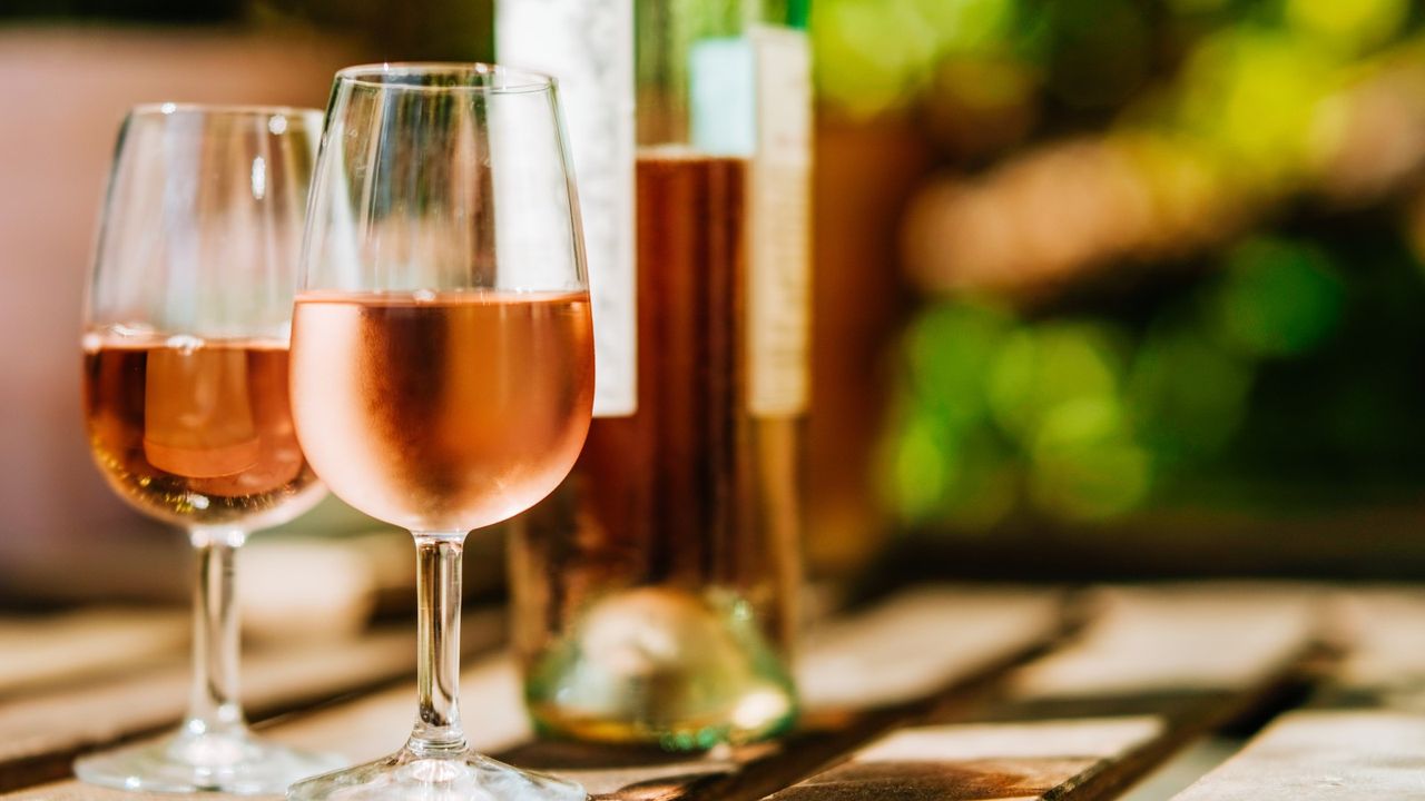 wine glasses and bottle in sunlight