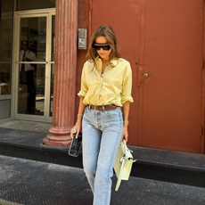 outfit image of Morgan Stewart wearing a yellow button-down shirt with Levi's jeans