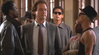 Jim Belushi stands in the middle of a group of intimidating students in The Principal.