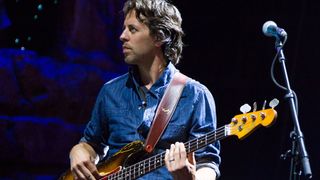 Bassist Sean Hurley of John Mayer's band performs at the DTE Energy Music Theater on August 7, 2013 in Clarkston, Michigan