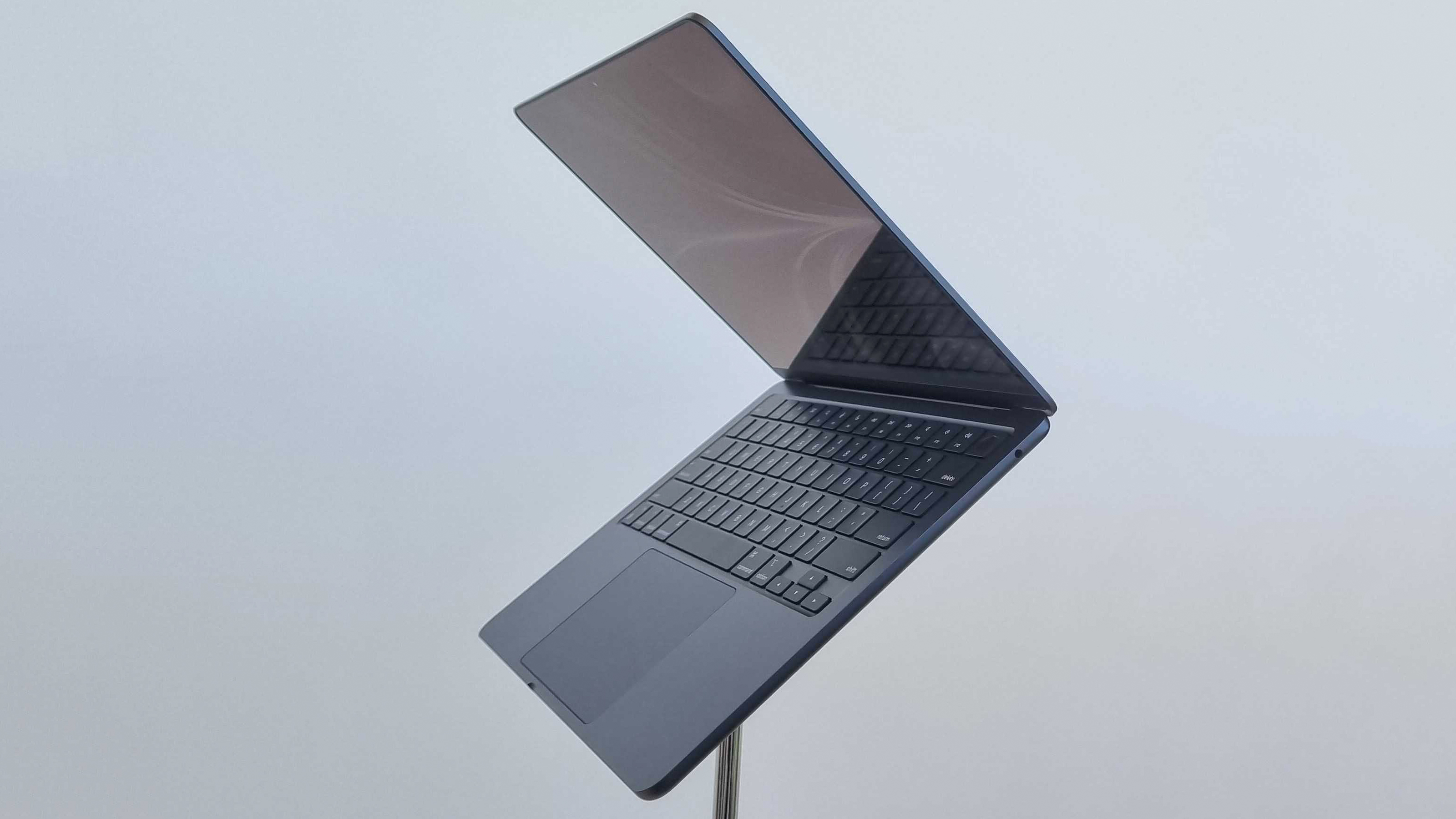 The Apple MacBook Air 2022 laptop on a stand