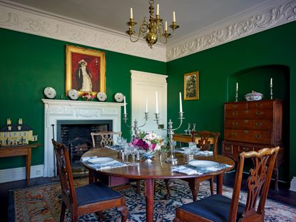 Fig 2: The dining room, in patriotic Lincoln Green, with its Rococo-style frieze. Fulbeck House, Lincolnshire. &copy;Paul Highnam for Country Life.