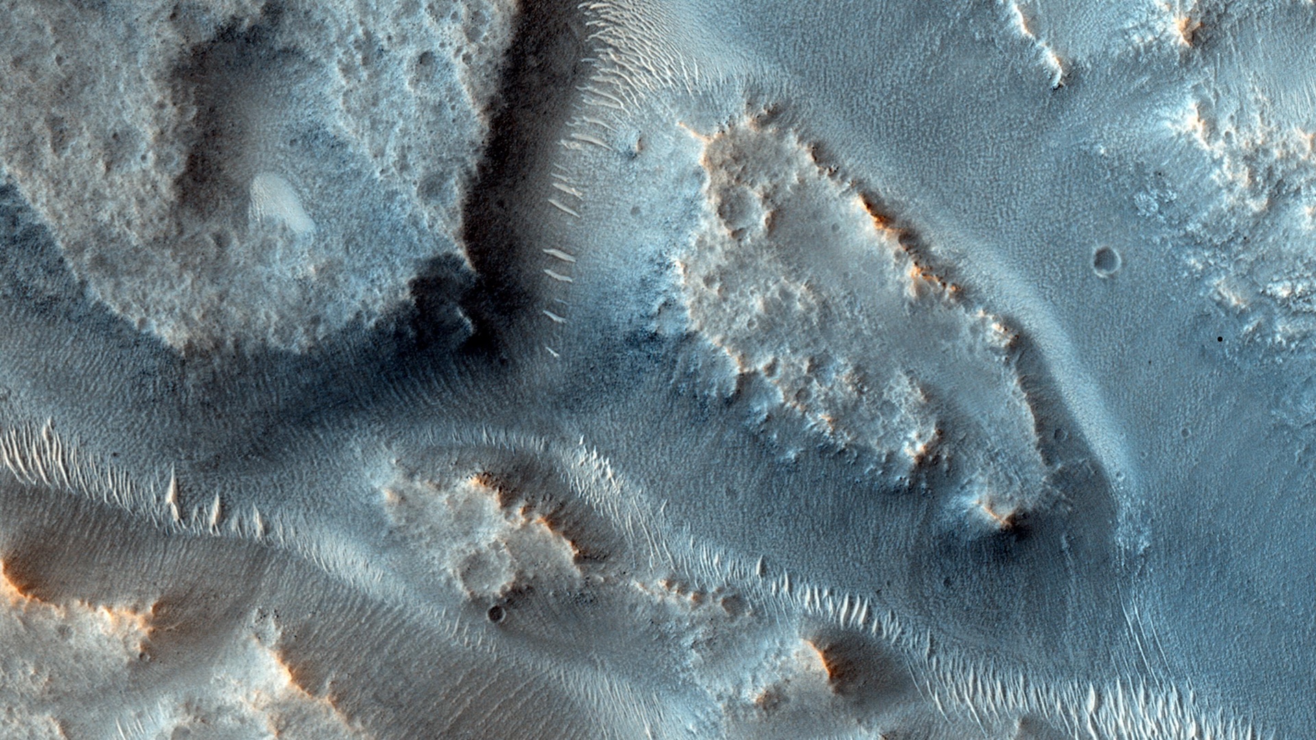 an aerial image of canyons on Mars