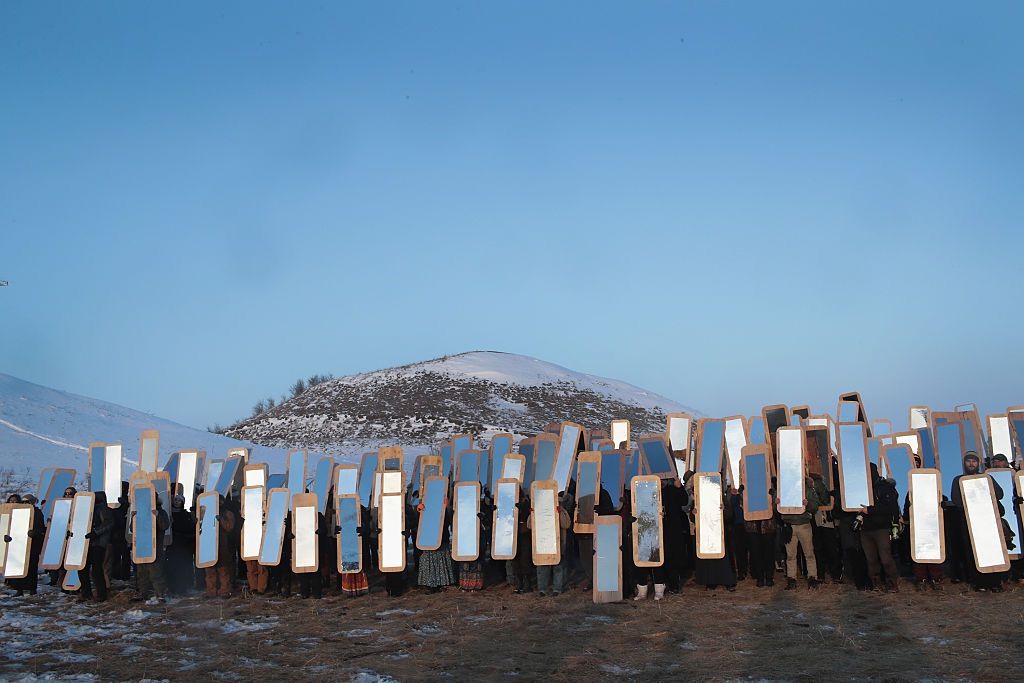 Activists participate in an art project conceived by Cannupa Hunska Luger, from the Standing Rock Sioux Tribe, on Dec. 3, 2016 outside Cannon Ball, North Dakota.