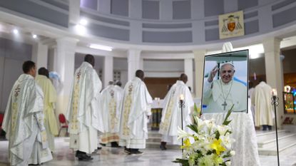 Catholic priests participate in a memorial service for Pope Francis in Dakar, Senegal, on April 25, 2025.