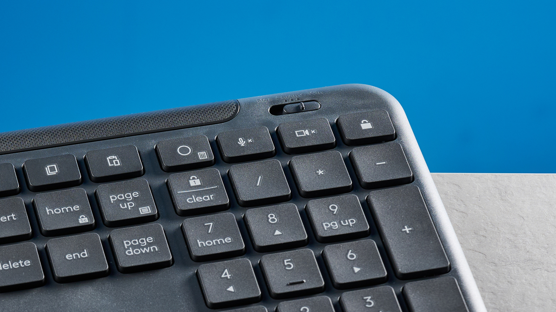 The Logitech K620 keyboard in a graphite grey colorway photographed as part of the MK625 como on able and white background.