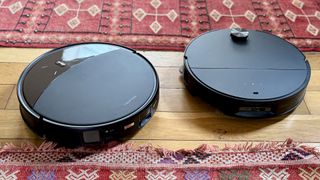 Roborock Saros 10R and Saros 10 robot vacuums side by side in reviewer's house