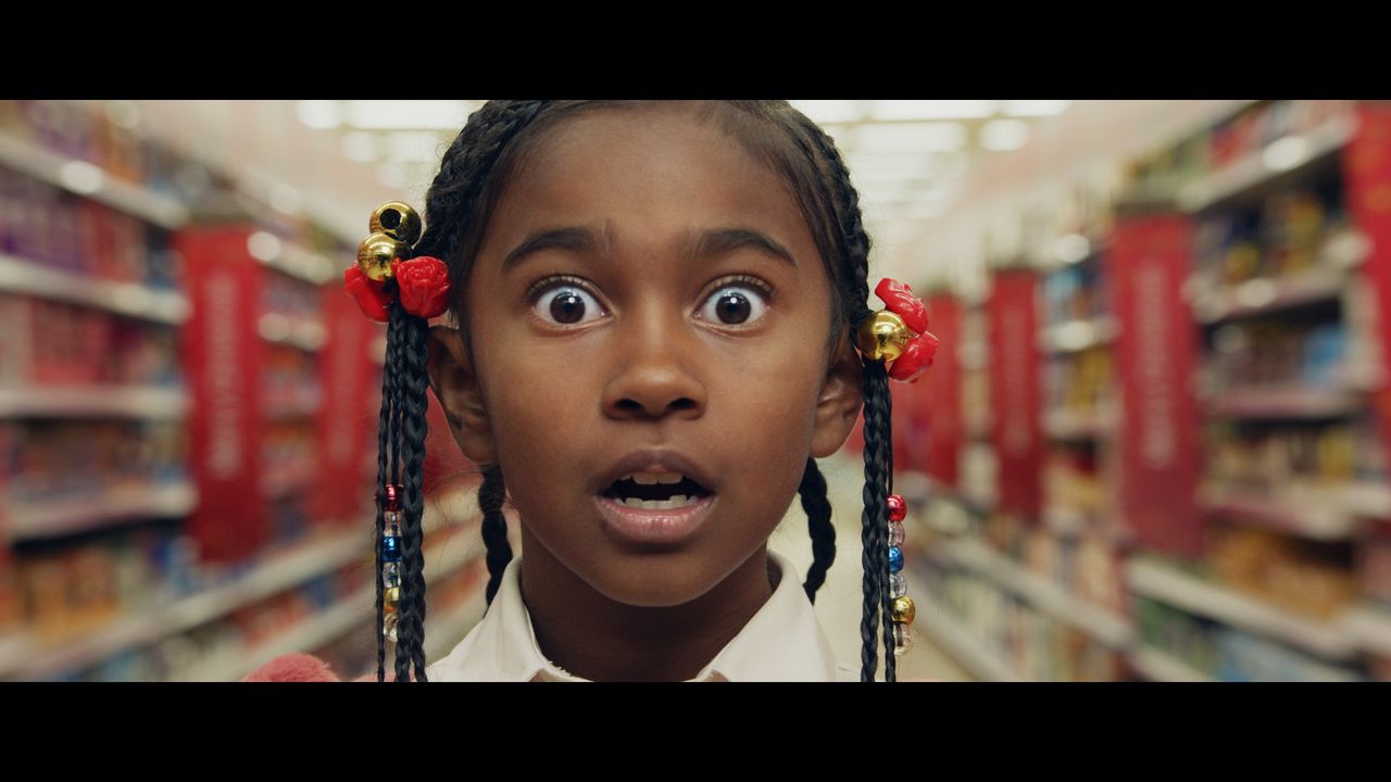 Little girl looking amazed in a Tesco store