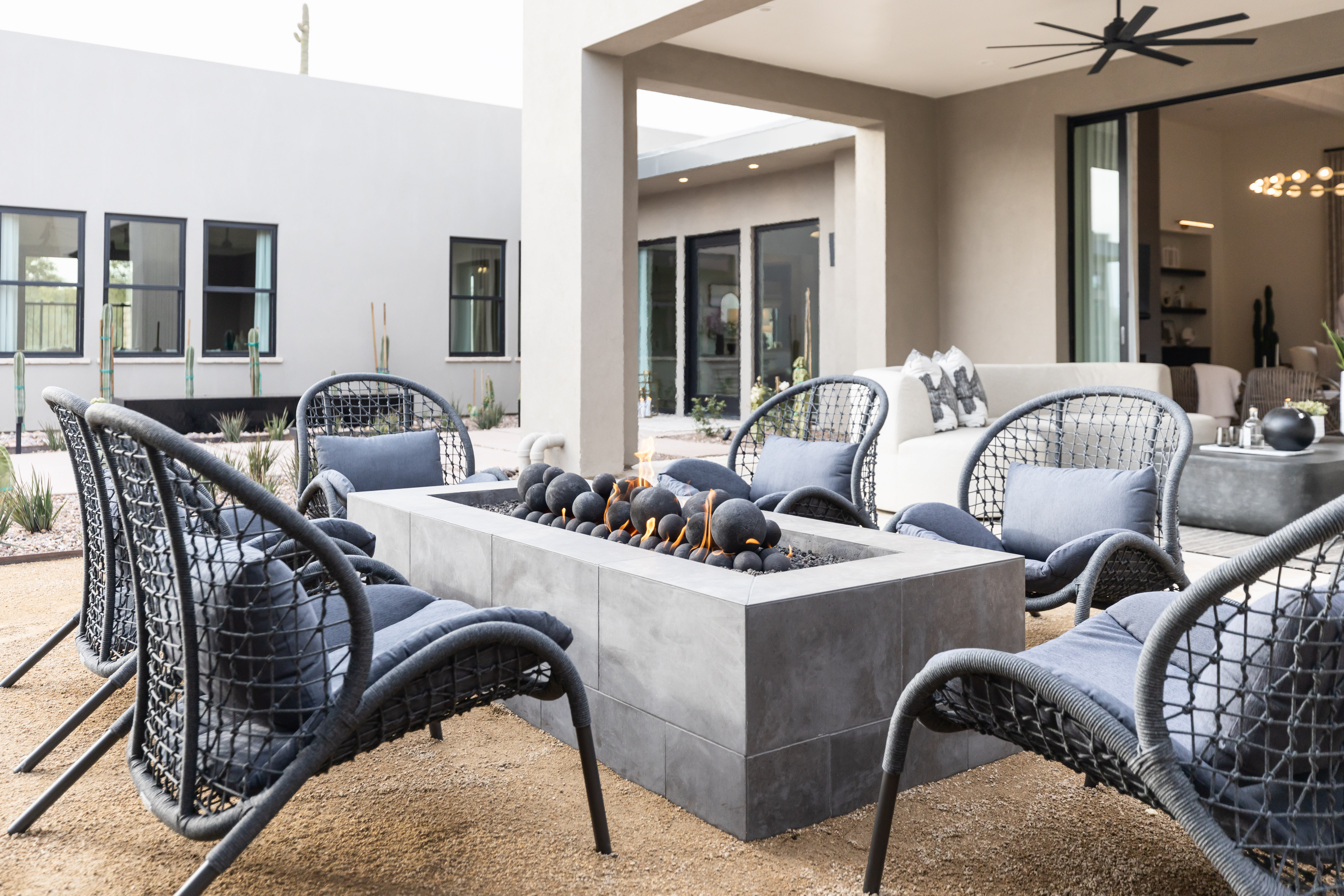 A grey tones outdoor firepit with matching seating