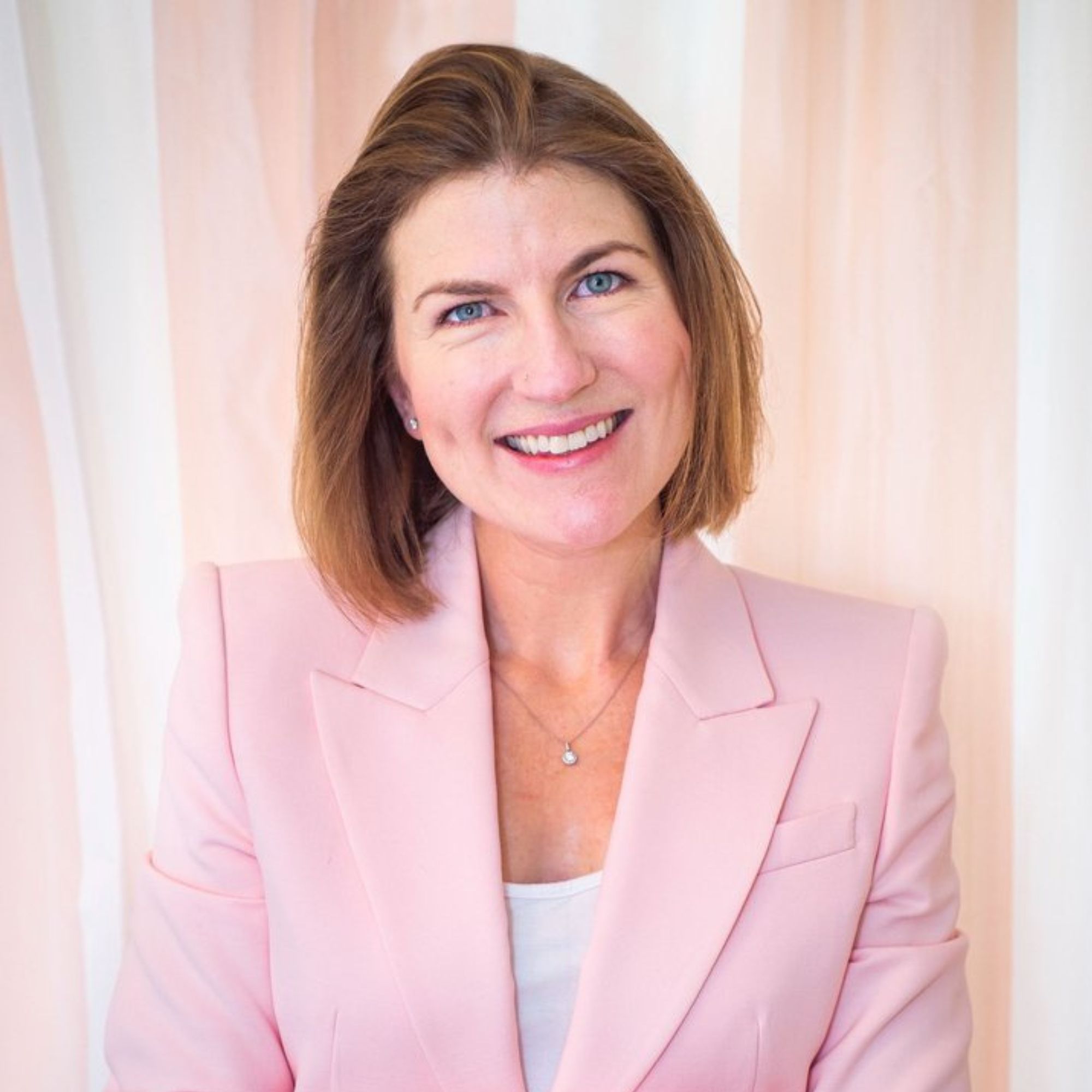 A picture of Lucy Milligan Wahl with a pink blazer on