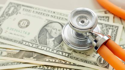 Stethoscope on dollars for Medicare