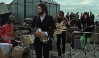 (From left) Ringo Starr, Paul McCartney, John Lennon, and George Harrison perform on a rooftop in London's Savile Row in 1969