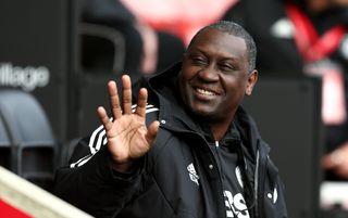 Emile Heskey waving prior to prior to the Women's Super League match between Manchester United and Leicester City