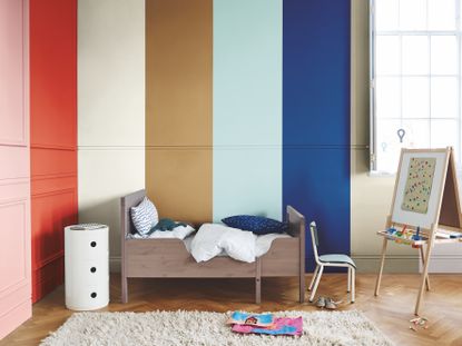 kids bedroom with rainbow painted wall by dulux