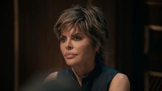 Lisa Rinna wearing black at the round table on The Traitors. 